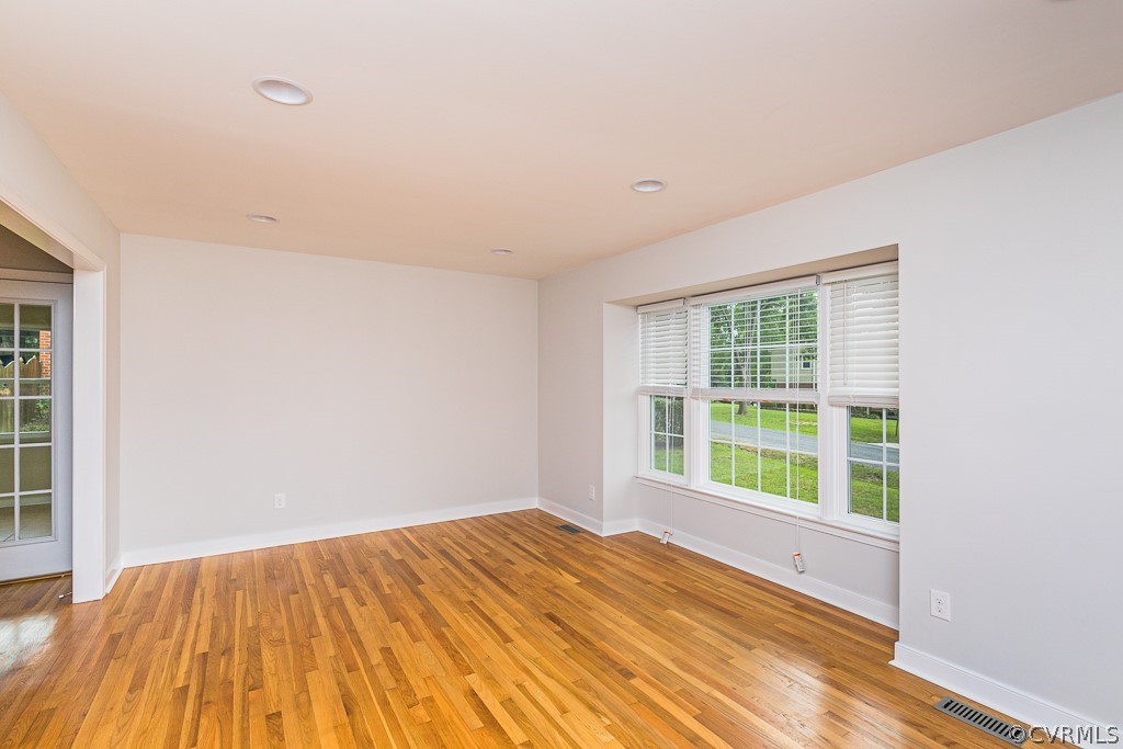 3703 Cheyenne Road Richmond, VA 23235 - Photo 8 of 21 a view of an empty room with wooden floor and a window