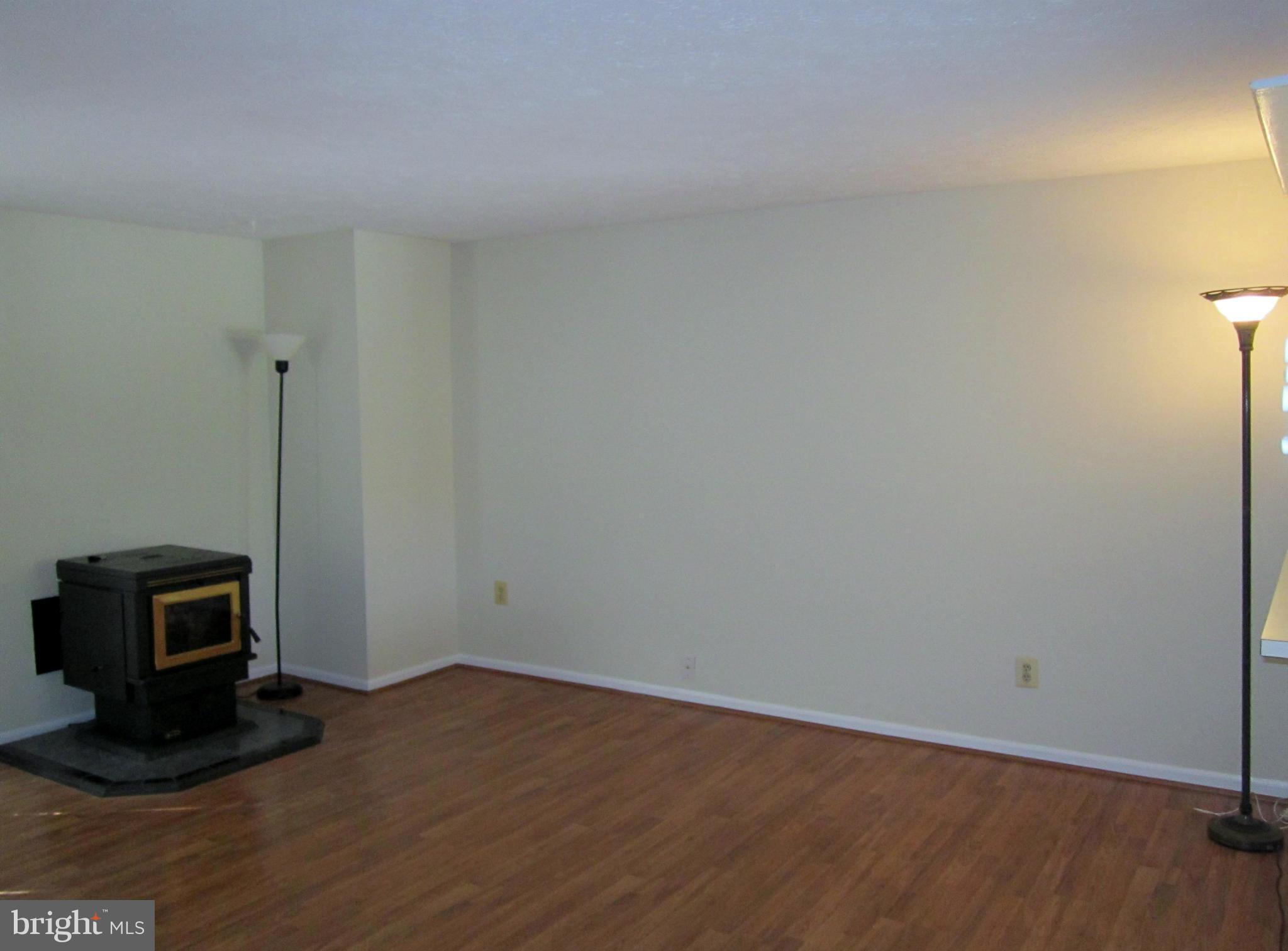 5021 Clifford Road Perry Hall, MD 21128 - Photo 6 of 15 a view of a room with wooden floor and a sink