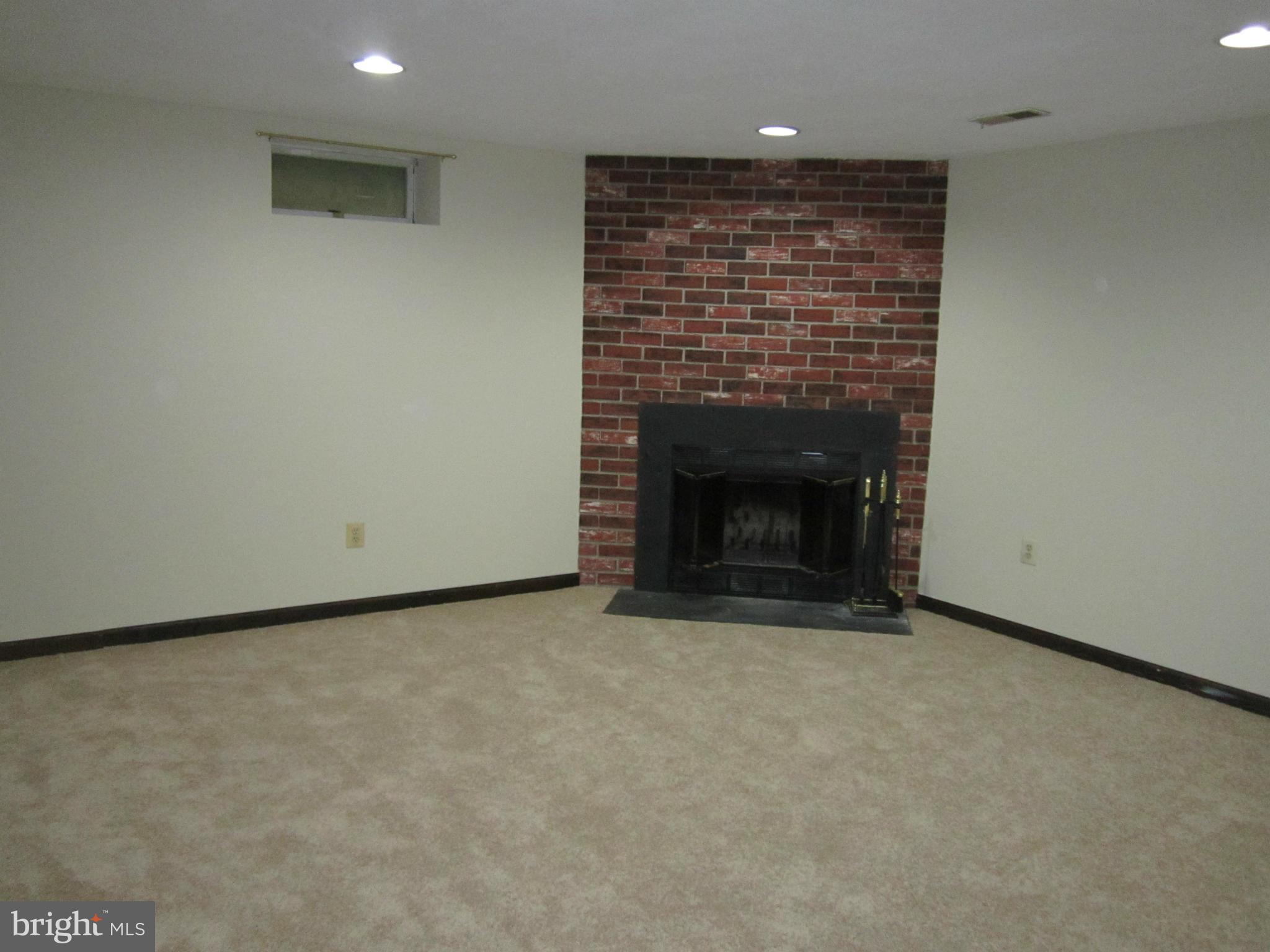 5021 Clifford Road Perry Hall, MD 21128 - Photo 9 of 15 an empty room with a fireplace