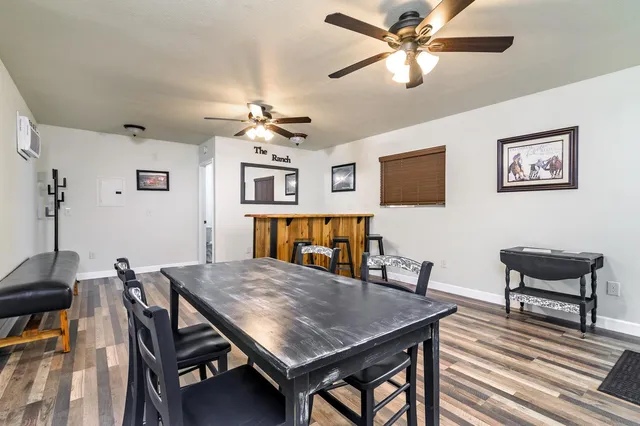 a bathroom with a sink a toilet a mirror and vanity
