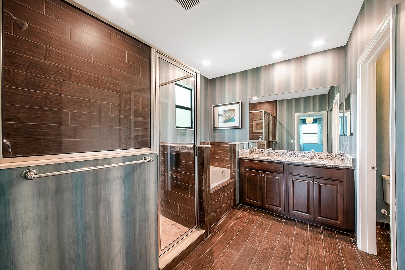 13076 Anthorne Lane Boynton Beach, FL 33436 - Photo 17 of 36 a kitchen with stainless steel appliances granite countertop a stove a sink and a refrigerator