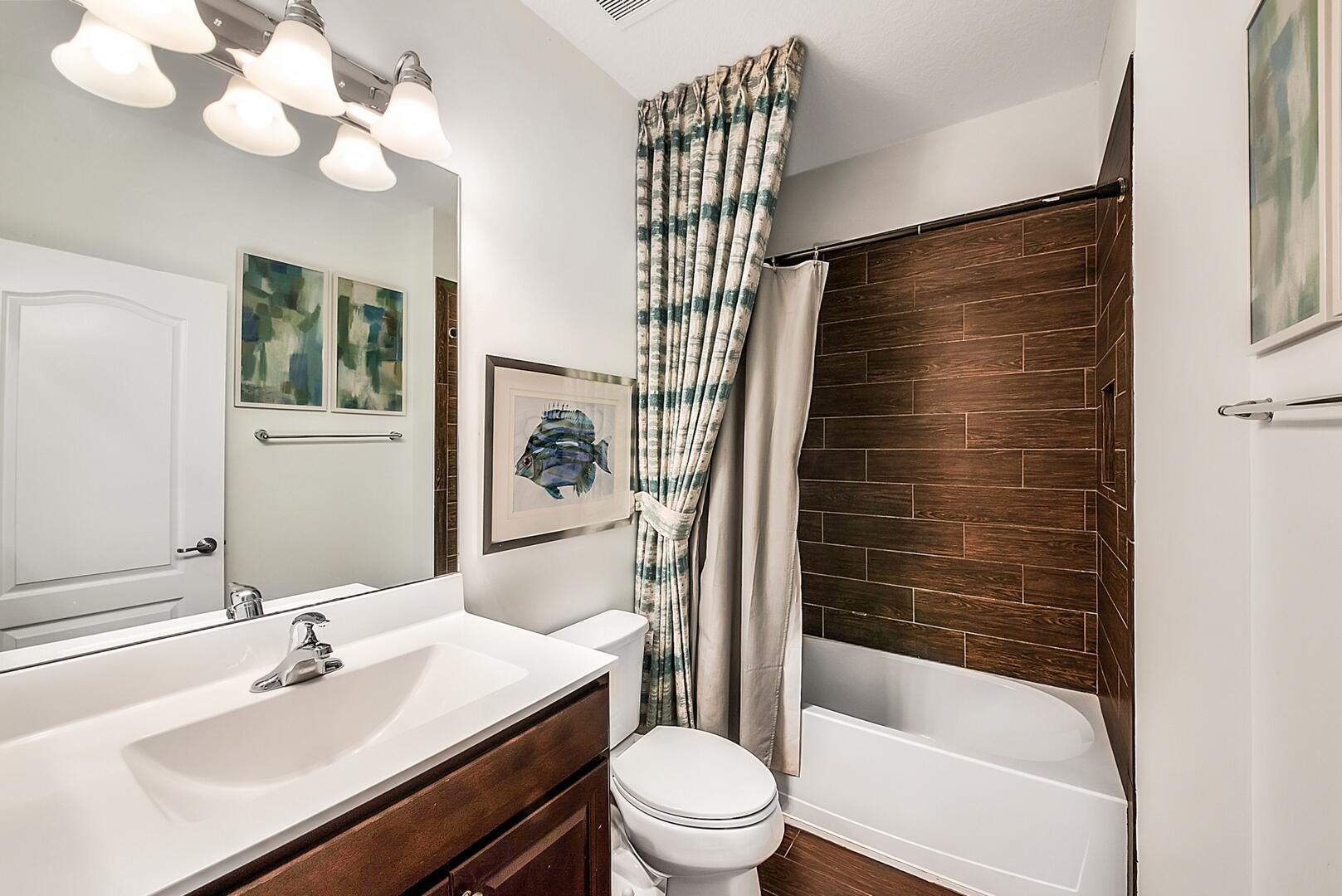 13076 Anthorne Lane Boynton Beach, FL 33436 - Photo 19 of 36 a bathroom with a sink a toilet a mirror and shower