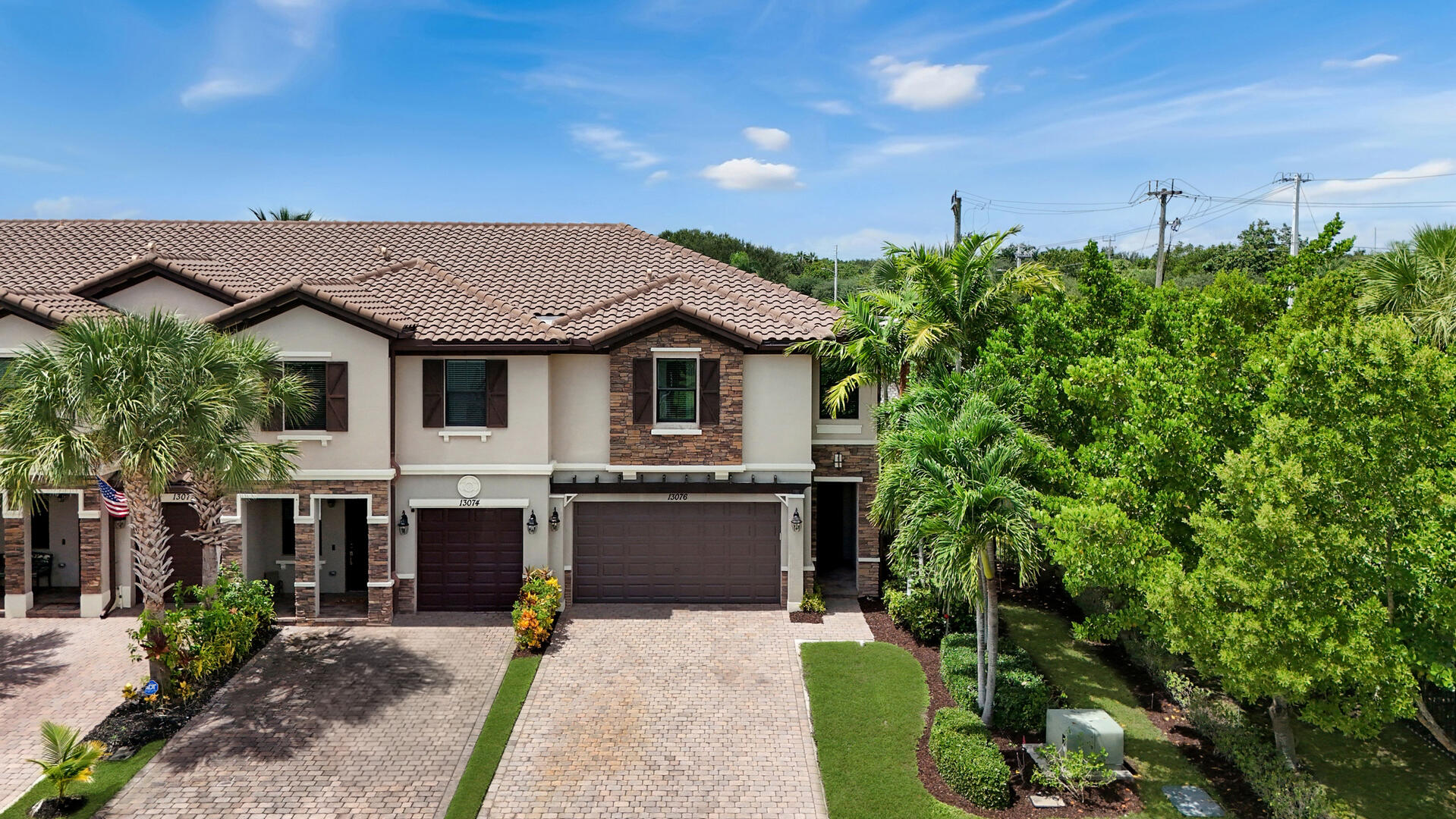 13076 Anthorne Lane Boynton Beach, FL 33436 - Photo 25 of 36 a front view of a house with a garden