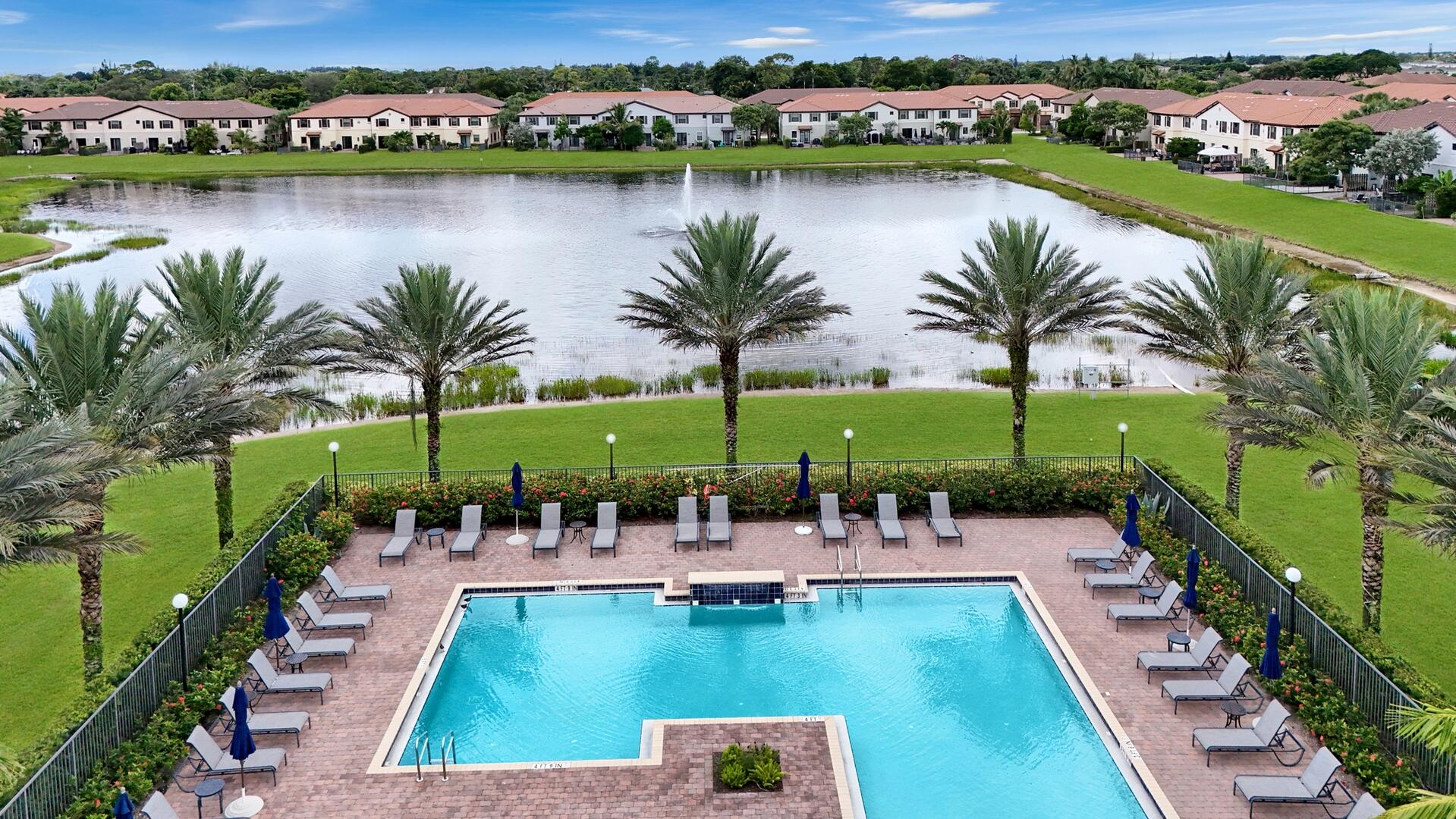 13076 Anthorne Lane Boynton Beach, FL 33436 - Photo 29 of 36 an aerial view of swimming pool with outdoor seating and lake view
