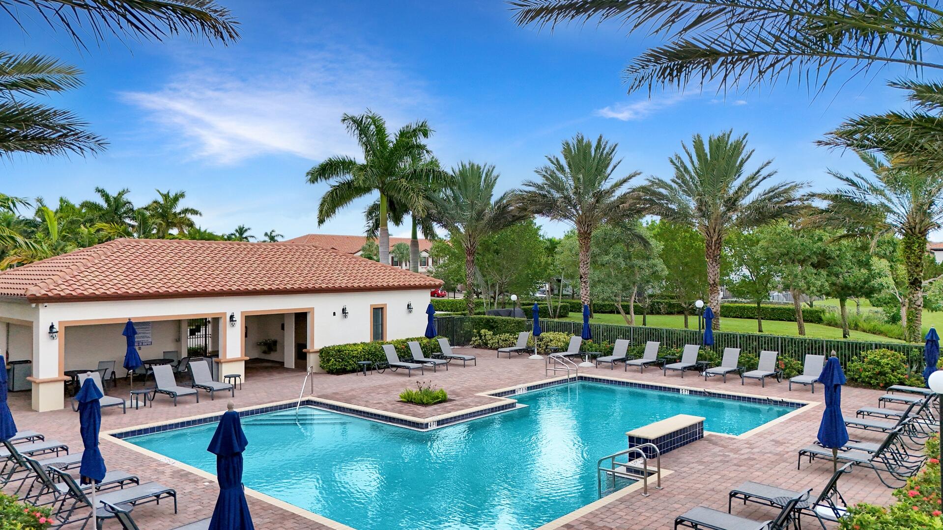13076 Anthorne Lane Boynton Beach, FL 33436 - Photo 30 of 36 a view of a house with swimming pool and sitting area