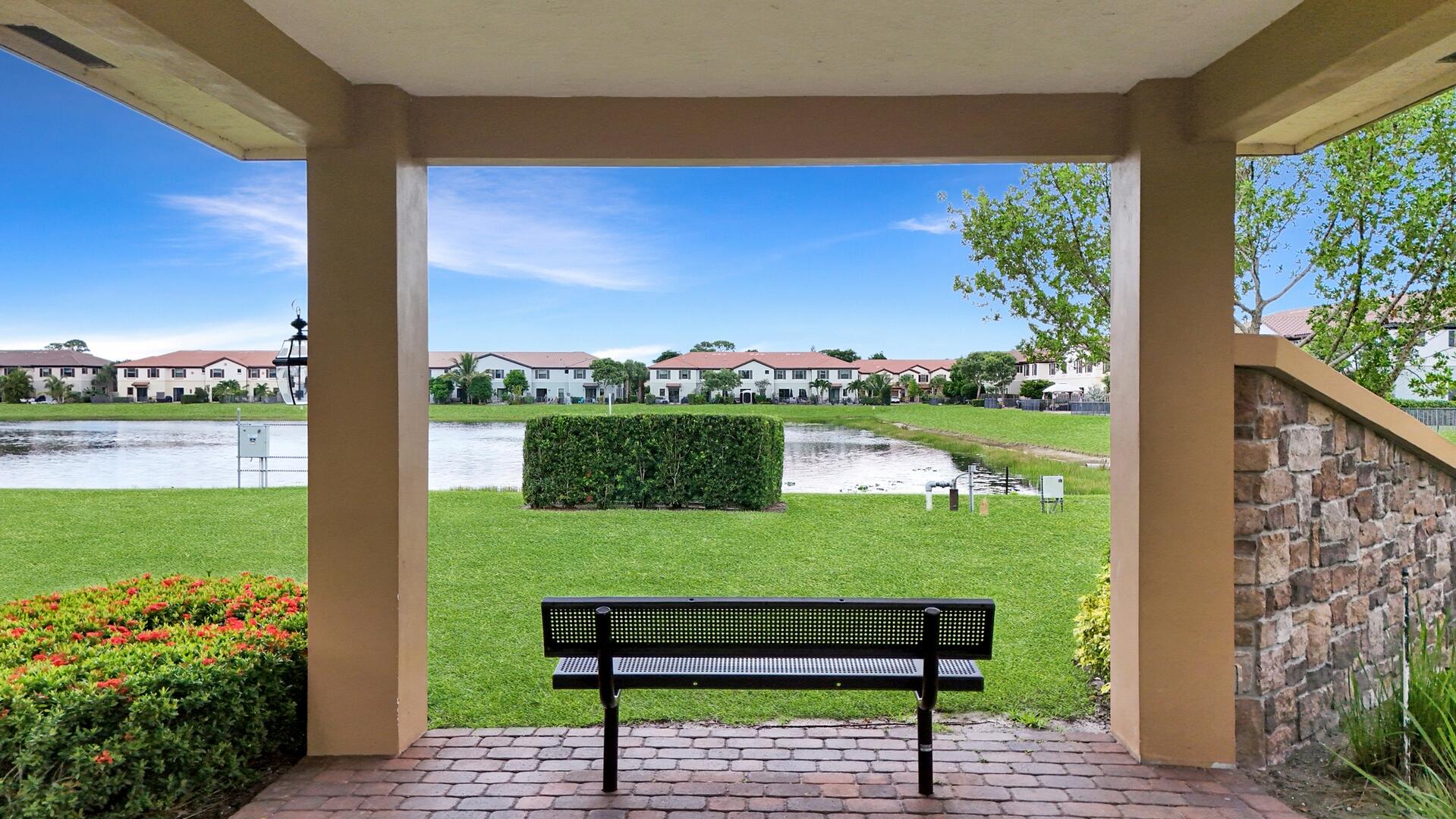 13076 Anthorne Lane Boynton Beach, FL 33436 - Photo 34 of 36 a view of a bench in front of building