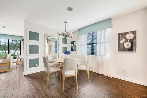 a view of a livingroom with furniture window and wooden floor
