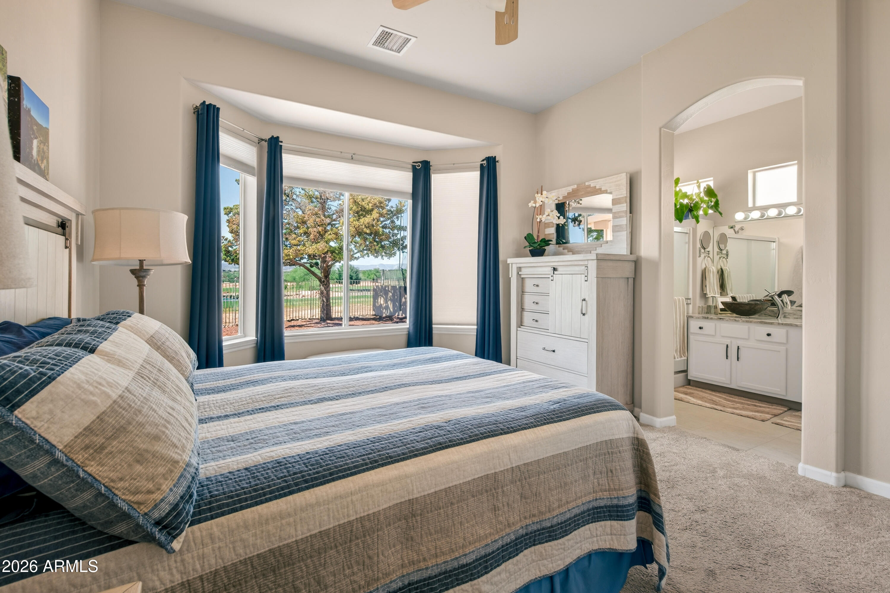 718 South Wandering River Road Cornville, AZ 86325 - Photo 19 of 41 a bedroom with a bed and a view of kitchen