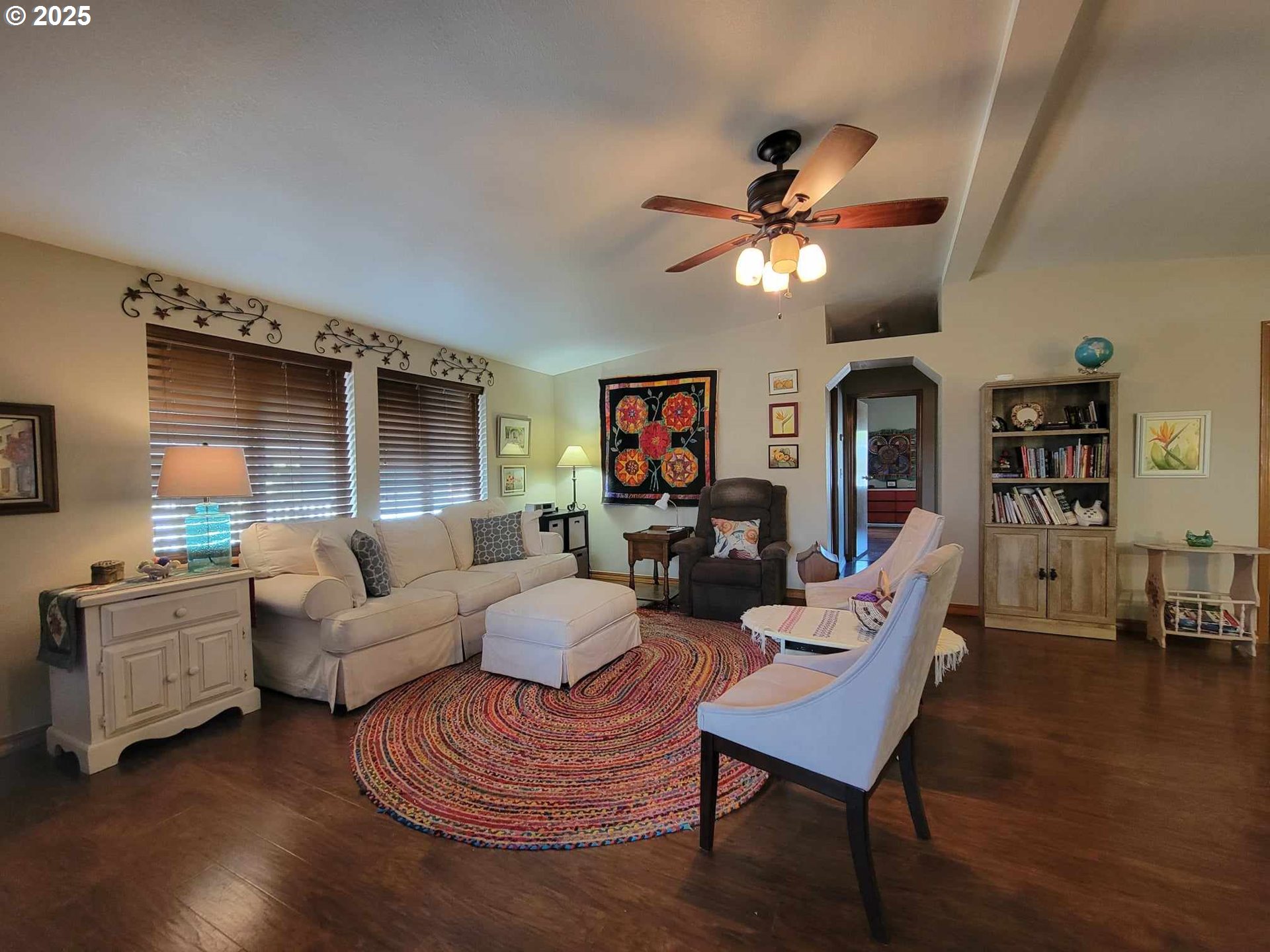 4413 Settlers Loop Forest Grove, OR 97116 - Photo 12 of 34 a living room with furniture a ceiling fan and a rug