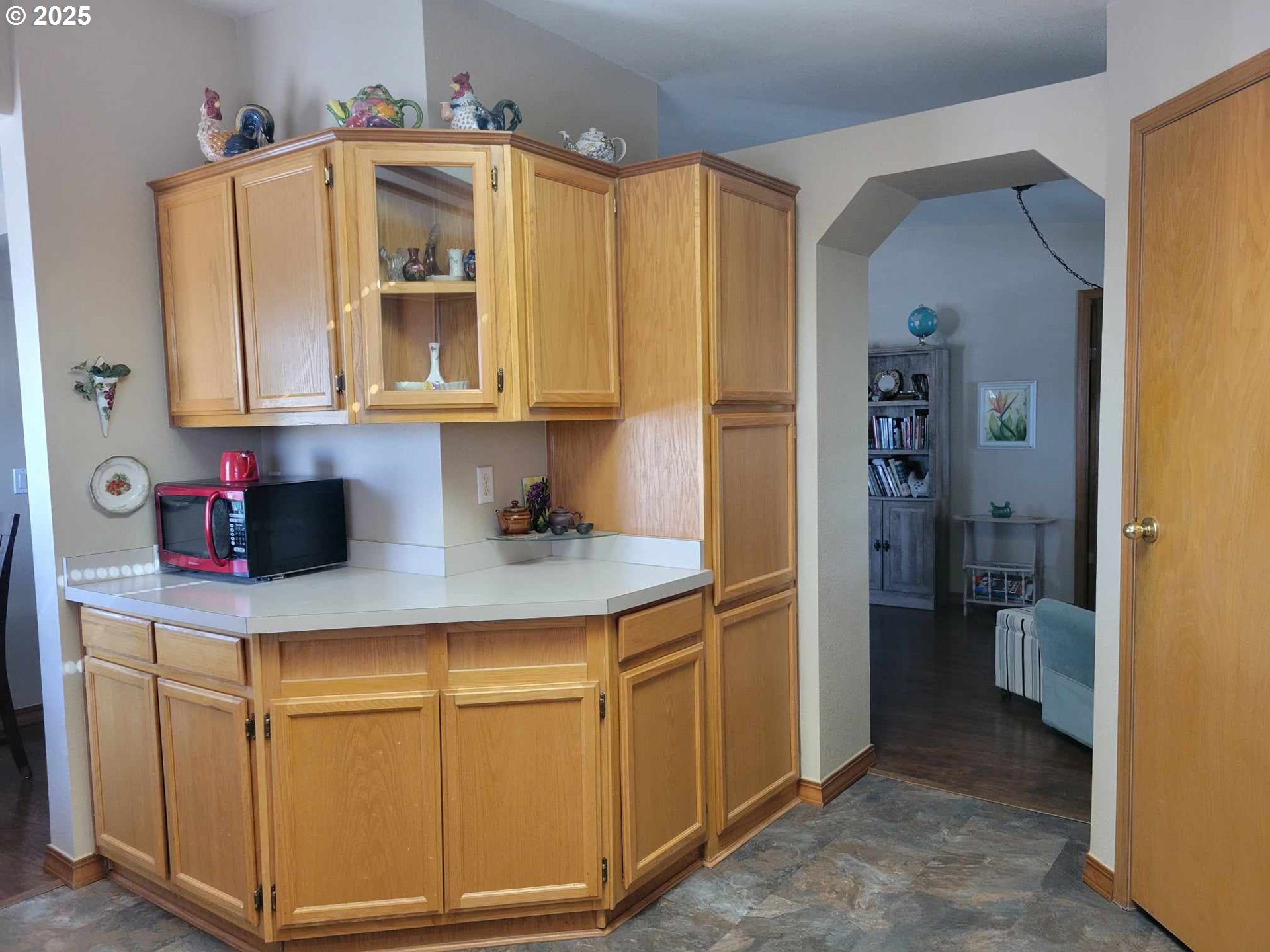 4413 Settlers Loop Forest Grove, OR 97116 - Photo 16 of 34 a kitchen with cabinets and a refrigerator