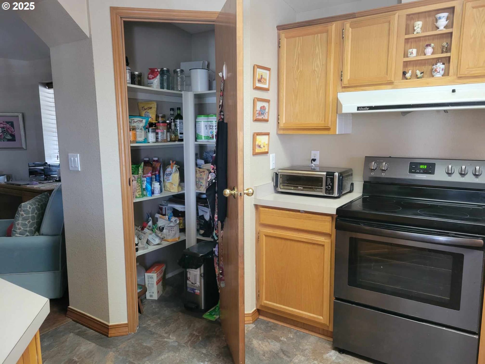 4413 Settlers Loop Forest Grove, OR 97116 - Photo 18 of 34 a kitchen with stainless steel appliances granite countertop a stove and a refrigerator