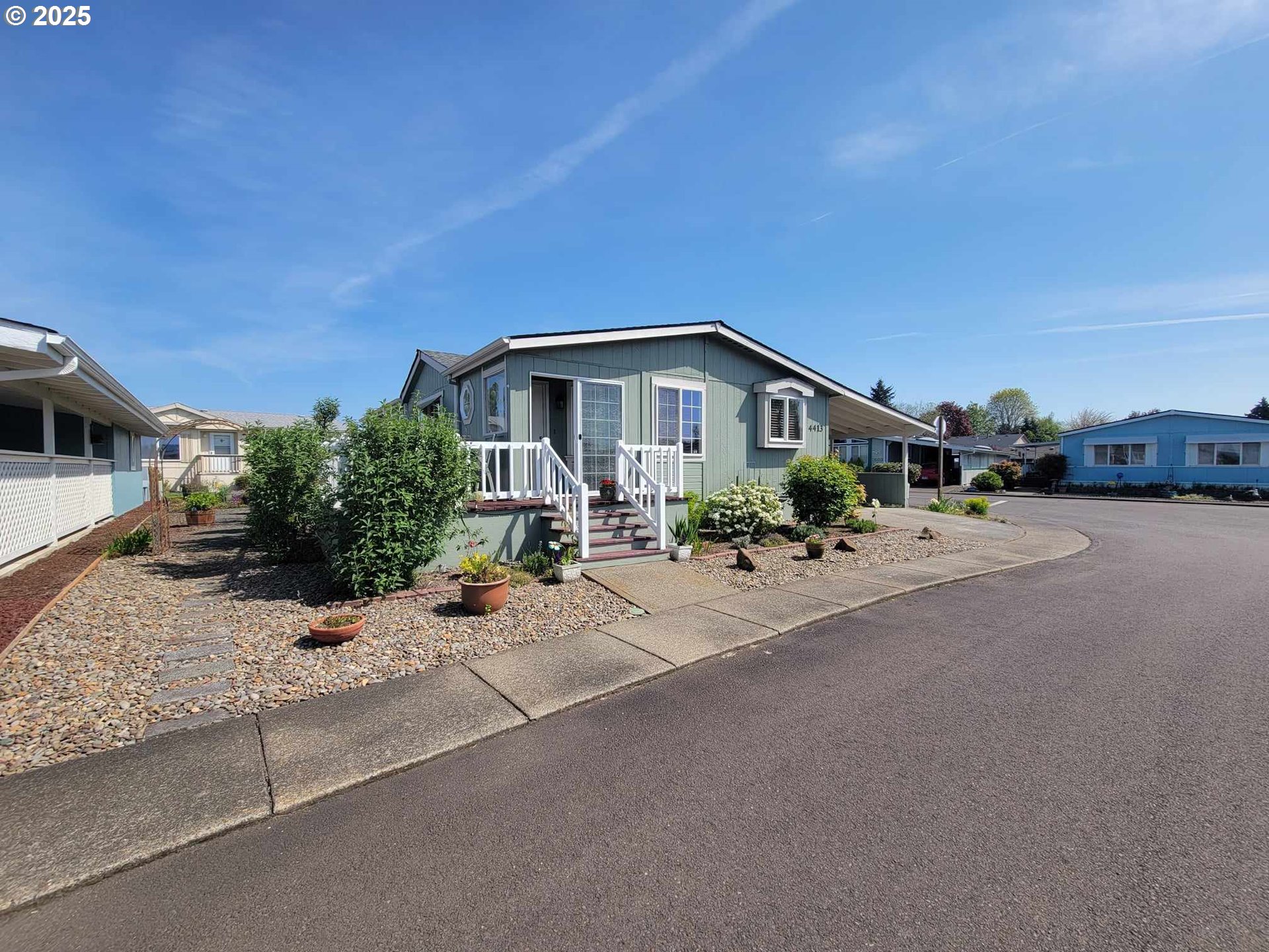 4413 Settlers Loop Forest Grove, OR 97116 - Photo 2 of 34 a front view of a house with a yard and garage