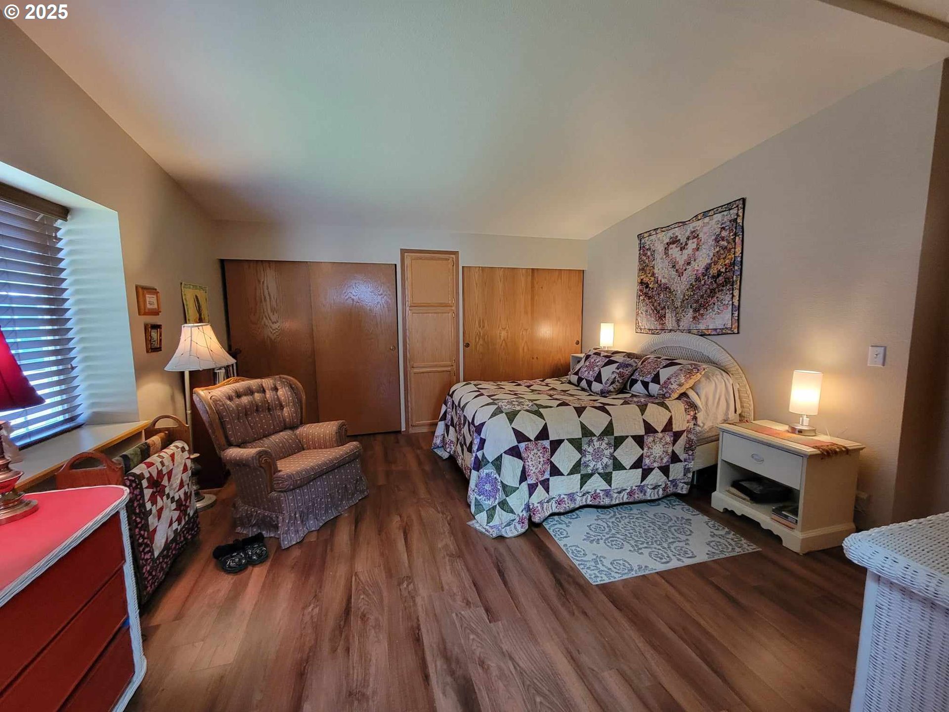 4413 Settlers Loop Forest Grove, OR 97116 - Photo 27 of 34 a bedroom with furniture and a wooden floor