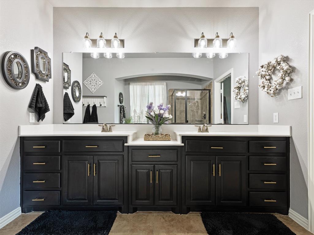 1120 Golden Sunset Court Prosper, TX 75078 - Photo 21 of 40 a bathroom with a sink vanity and a mirror