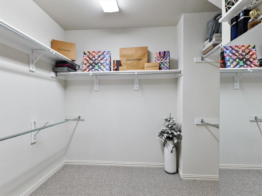1120 Golden Sunset Court Prosper, TX 75078 - Photo 22 of 40 a view of storage and utility room with racks on the wall
