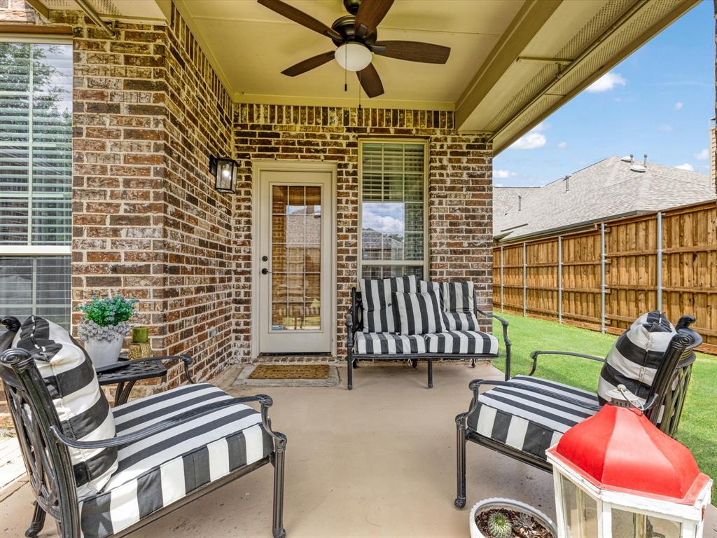 1120 Golden Sunset Court Prosper, TX 75078 - Photo 32 of 40 a view of a patio with a table and chairs