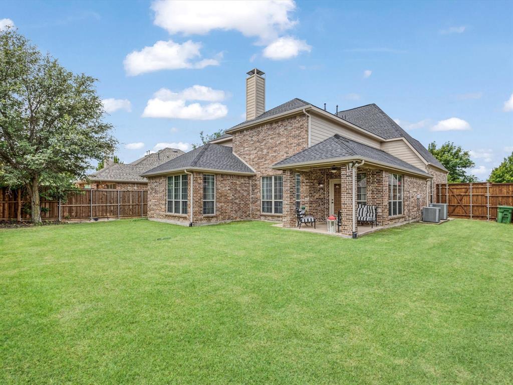 1120 Golden Sunset Court Prosper, TX 75078 - Photo 33 of 40 a view of a house with a yard