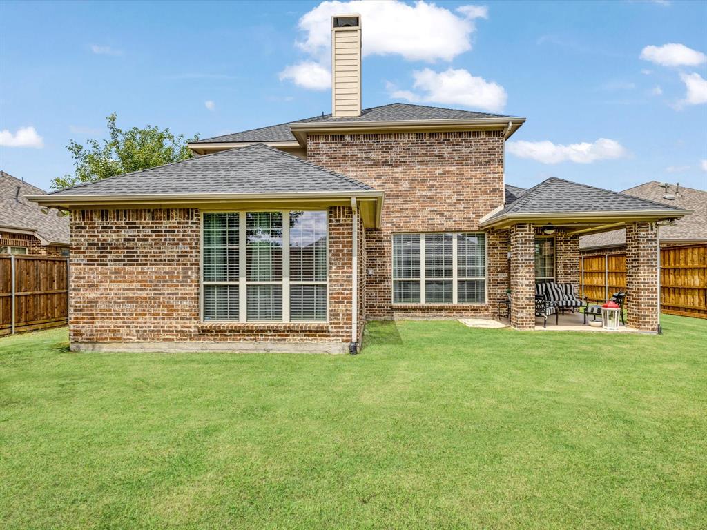 1120 Golden Sunset Court Prosper, TX 75078 - Photo 34 of 40 a front view of a house with a yard