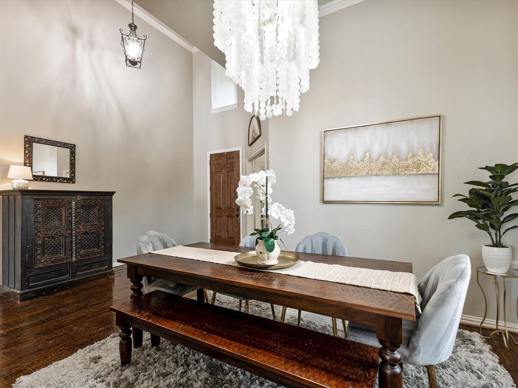 1120 Golden Sunset Court Prosper, TX 75078 - Photo 9 of 40 a view of a dining room with furniture and wooden floor