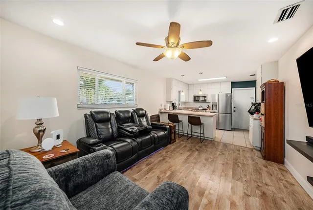 a living room with furniture and a window