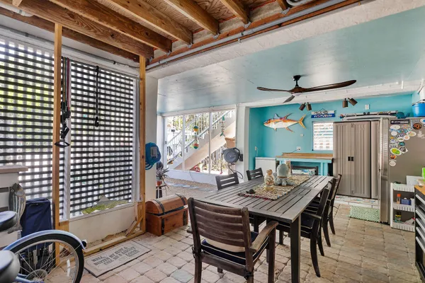 a dining room with furniture and window