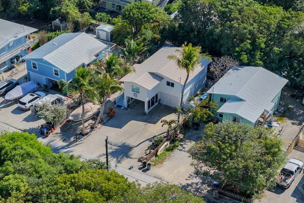 a view of backyard with outdoor seating and flowers