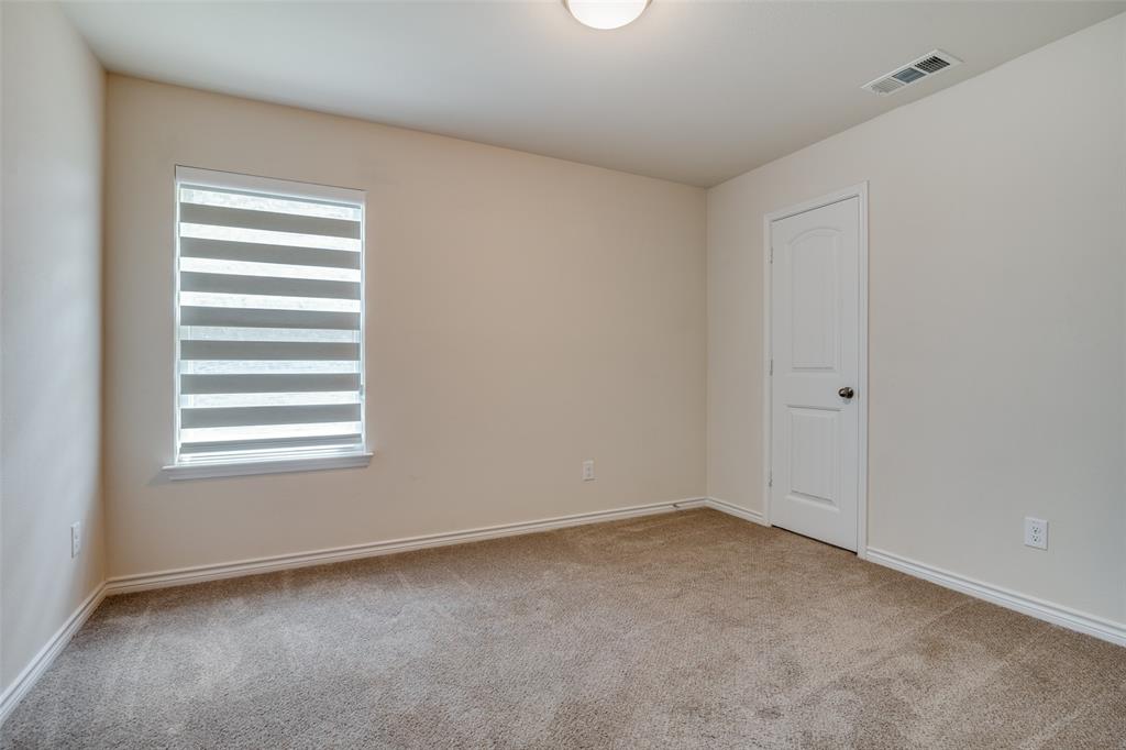 3504 Robin Road Ennis, TX 75119 - Photo 13 of 27 an empty room with a window