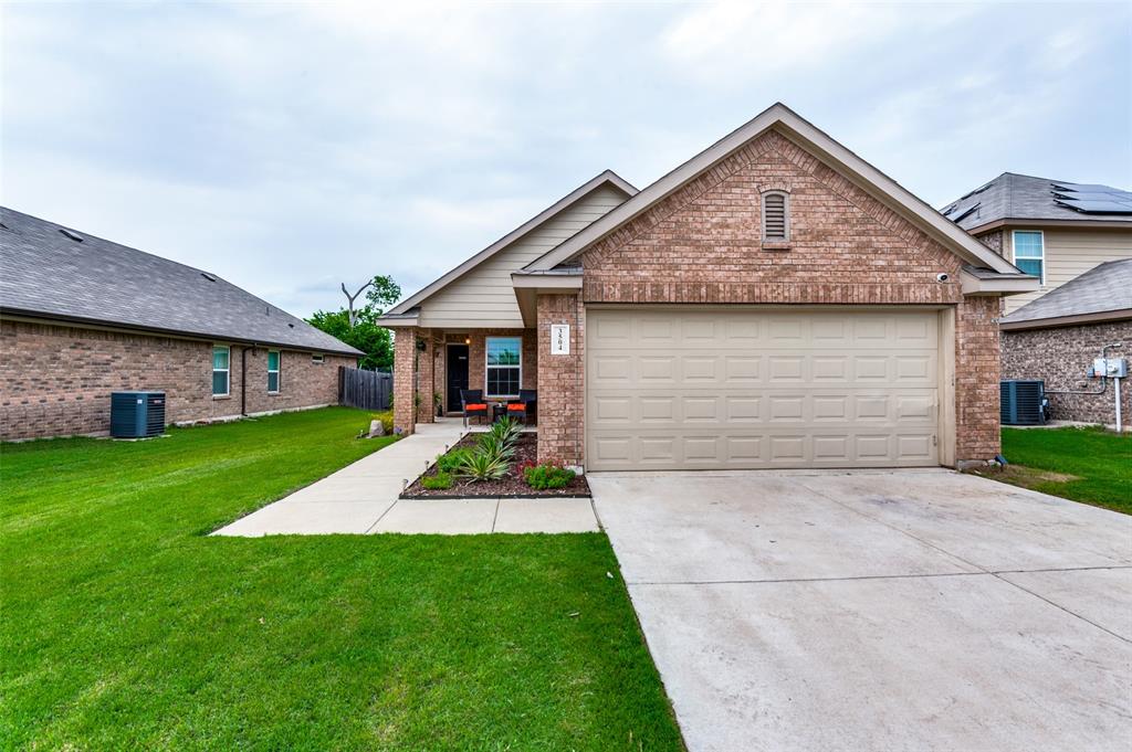 3504 Robin Road Ennis, TX 75119 - Photo 24 of 27 a front view of a house with a yard