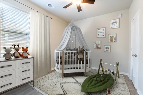 a bedroom with furniture and a window