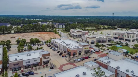 an aerial view of a house with outdoor space