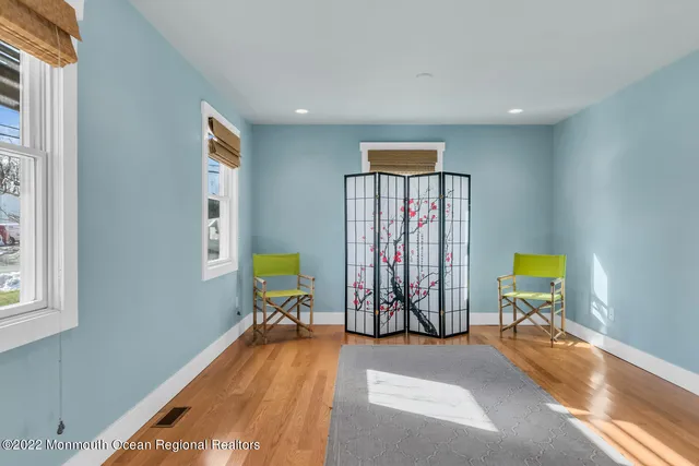a view of a room with gym equipment and windows