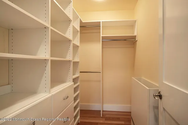 a bathroom with a walk in closet