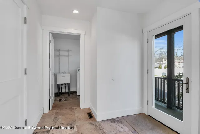 a view of a bathroom with a sink and a mirror