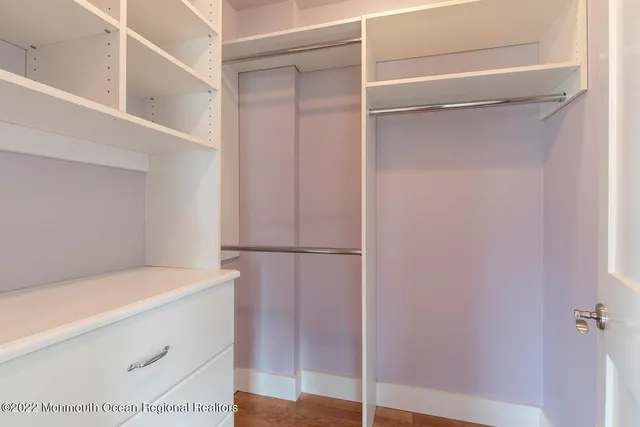 a bathroom with a toilet a sink and a mirror