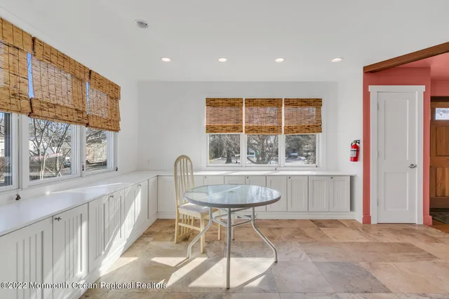 a living room with a table and chair