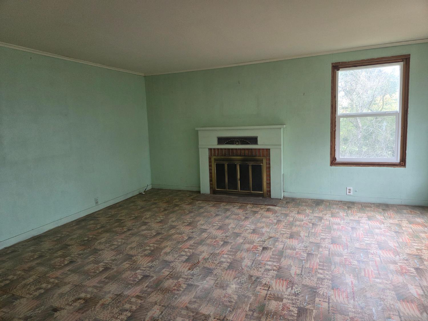 291 Sunset Street San Andreas, CA 95249 - Photo 2 of 5 a view of empty room with a fireplace
