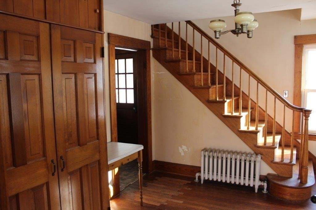 737 Worcester Road Barre, MA 01005 - Photo 12 of 19 a view of entryway with wooden floor and stairs