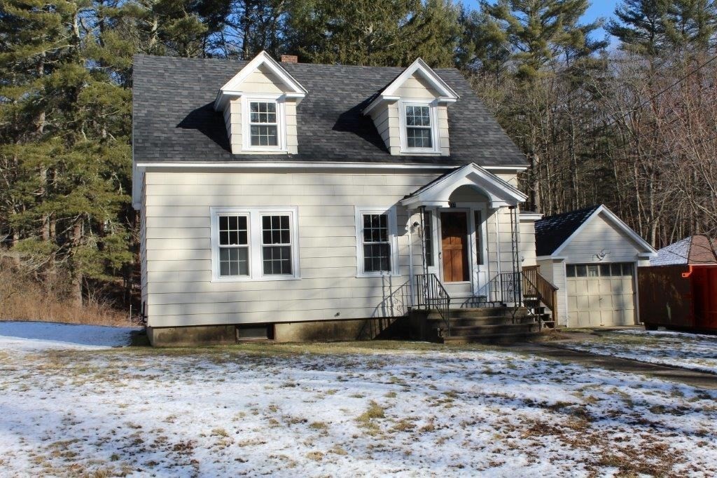 737 Worcester Road Barre, MA 01005 - Photo 2 of 19 a front view of a house with a yard