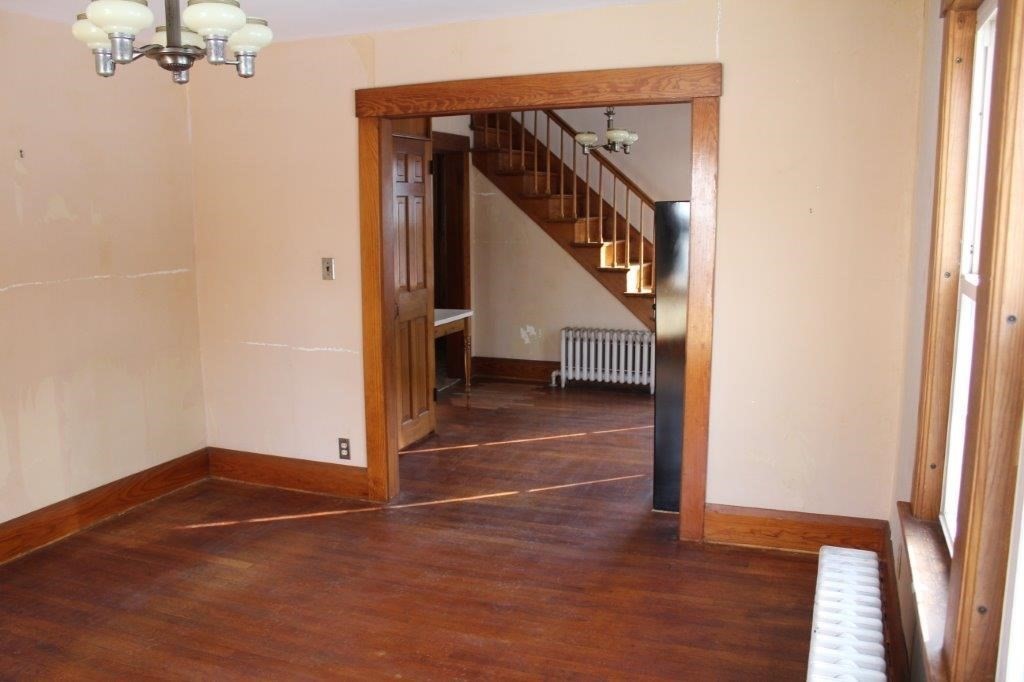 737 Worcester Road Barre, MA 01005 - Photo 5 of 19 a view of a livingroom with wooden floor and stairs