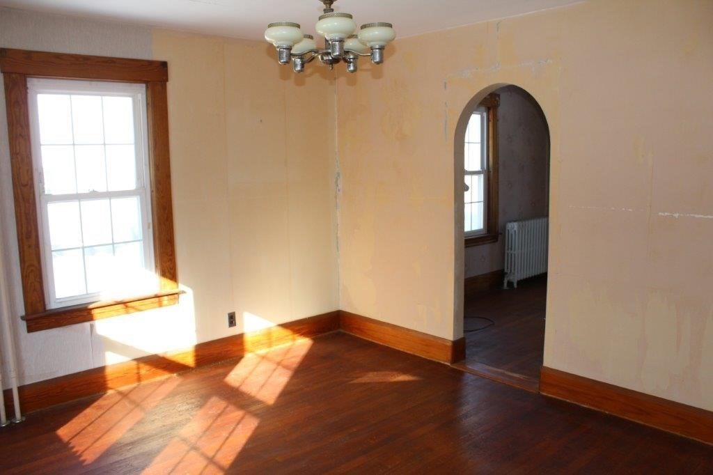 737 Worcester Road Barre, MA 01005 - Photo 6 of 19 a view of empty room with wooden floor and fan