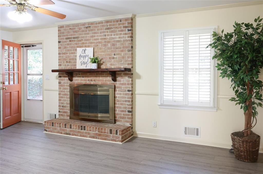 3969 Briaridge Circle Atlanta, GA 30340 - Photo 12 of 35 a living room with a fireplace and wooden floor