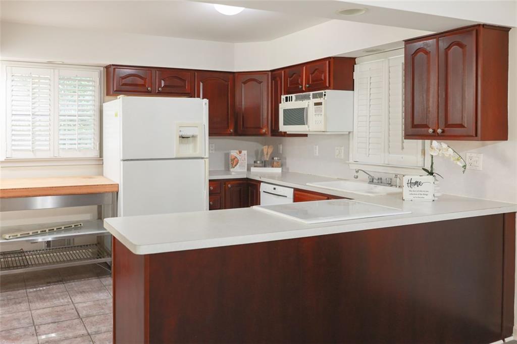 3969 Briaridge Circle Atlanta, GA 30340 - Photo 15 of 35 a kitchen with a sink a stove and a refrigerator