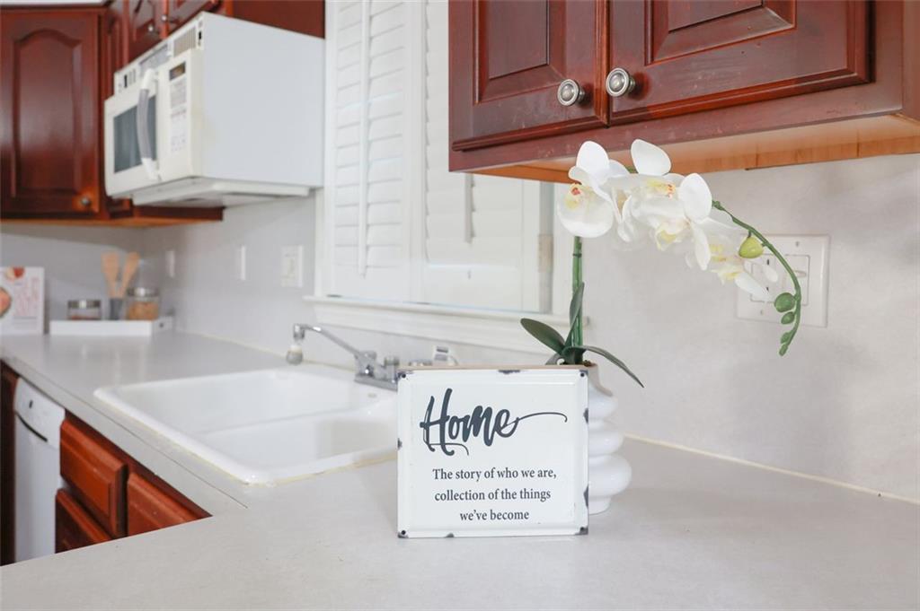3969 Briaridge Circle Atlanta, GA 30340 - Photo 16 of 35 a bathroom with a sink a mirror and vanity