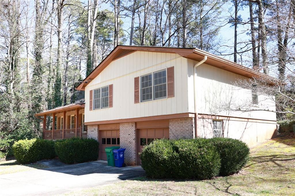 3969 Briaridge Circle Atlanta, GA 30340 - Photo 2 of 35 a front view of a house with a yard