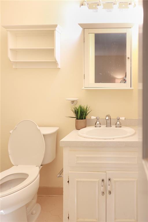 3969 Briaridge Circle Atlanta, GA 30340 - Photo 24 of 35 a bathroom with a sink a toilet and mirror
