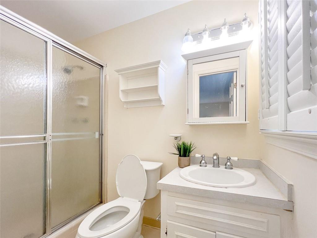 3969 Briaridge Circle Atlanta, GA 30340 - Photo 30 of 35 a white toilet sitting next to a bathroom sink