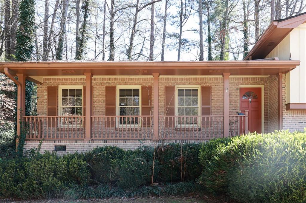 3969 Briaridge Circle Atlanta, GA 30340 - Photo 3 of 35 a view of a house with large windows and a yard