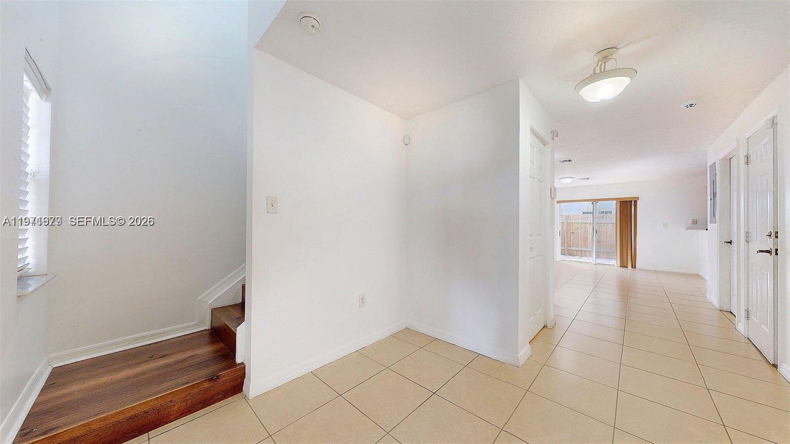 14162 Southwest 260th Street, Unit 104 Homestead, FL 33032 - Photo 19 of 35 a view of an empty room