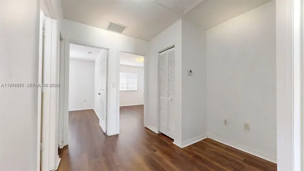wooden floor in a hall with an entryway