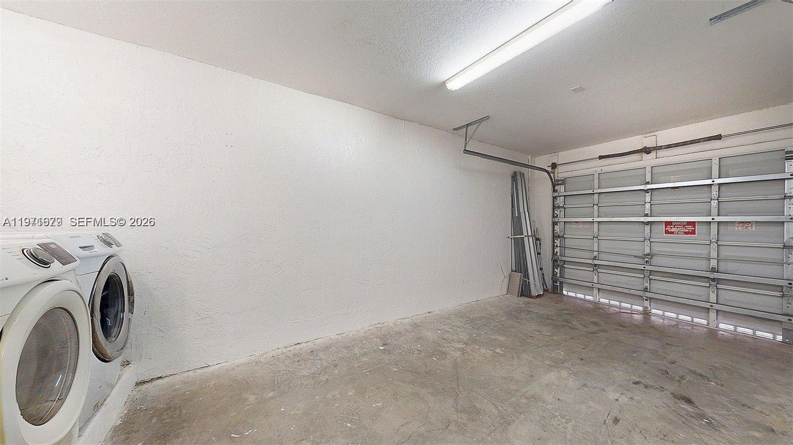 14162 Southwest 260th Street, Unit 104 Homestead, FL 33032 - Photo 32 of 35 a view of walk in closet with clothes